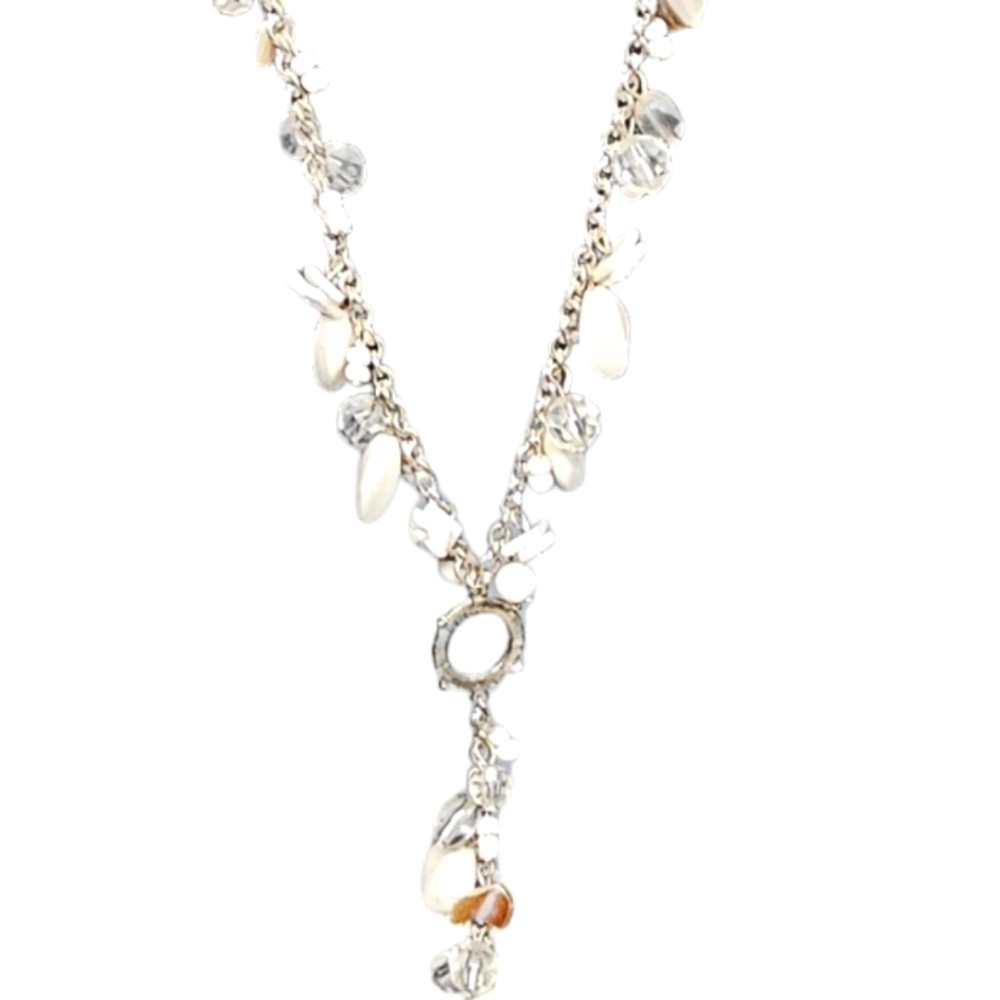Silver and white statement necklace beads and lots of detail.